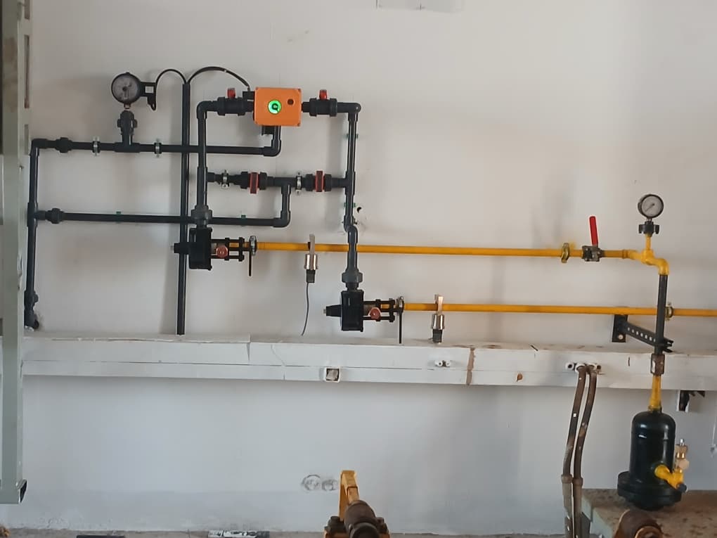 Installed laboratory service piping overview with gauges and valves