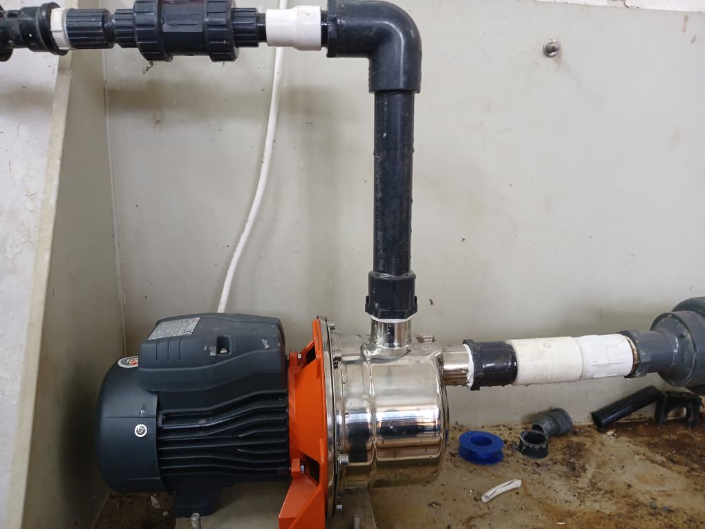 Horizontal motive pump connection with black pipework at Sekyere Hemmang